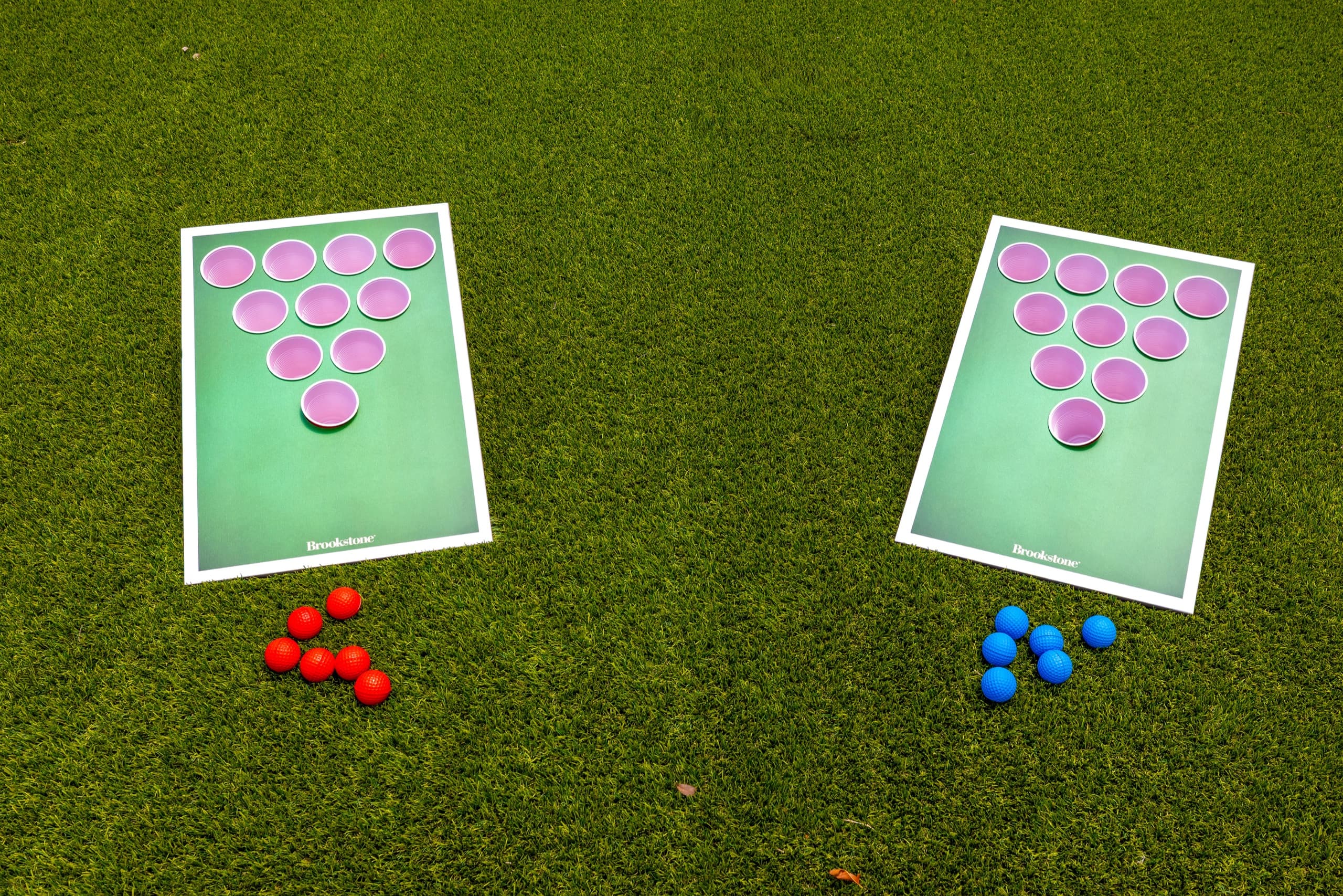 Two lawn-game boards on the grass, seen from above.